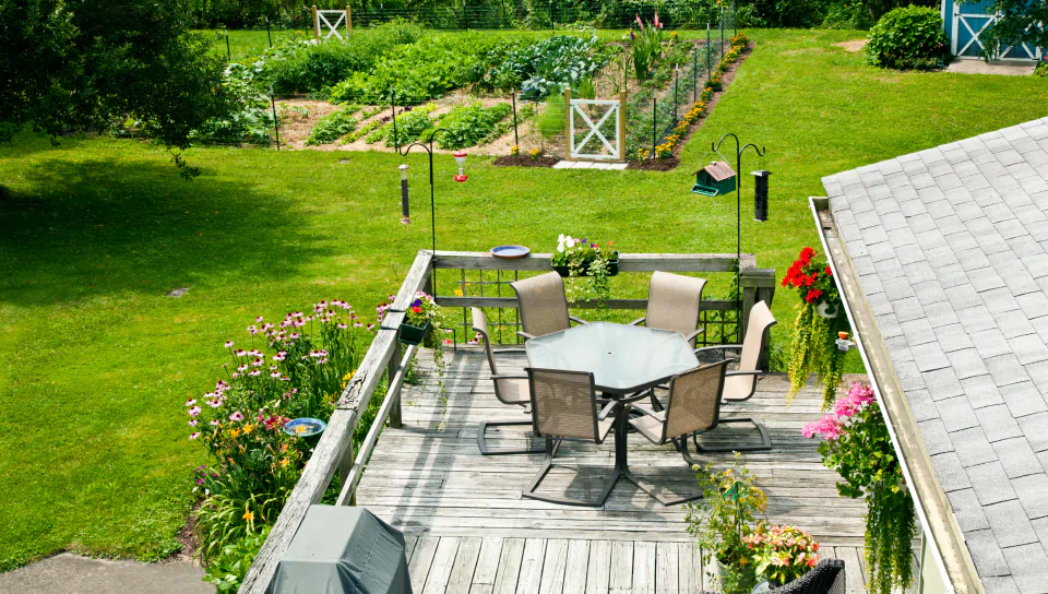 backyard deck with plants and flowers
