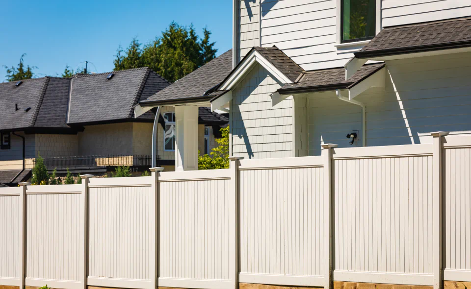 residential house with vinyl fence